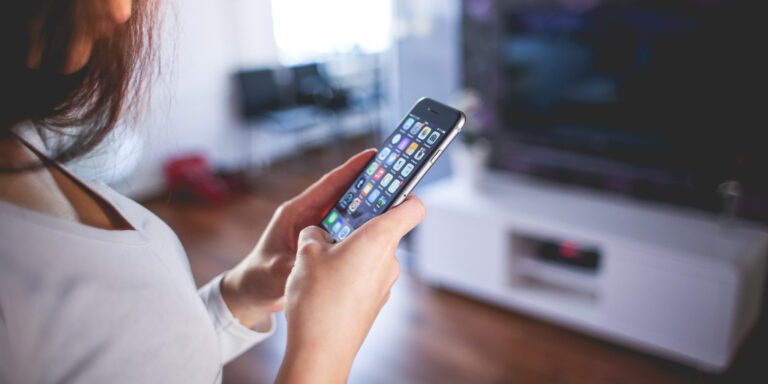 Our Family Wizard: woman using mobile phone